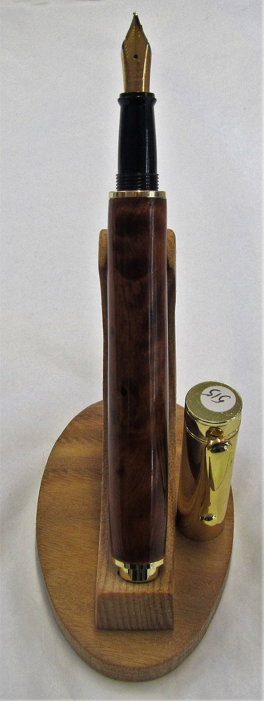 Handcrafted Thuya Burr wood pen with various fittings and pen types.