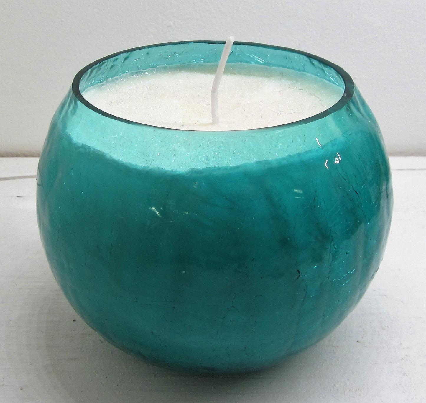 Handcrafted beautiful blue glass pot with candle