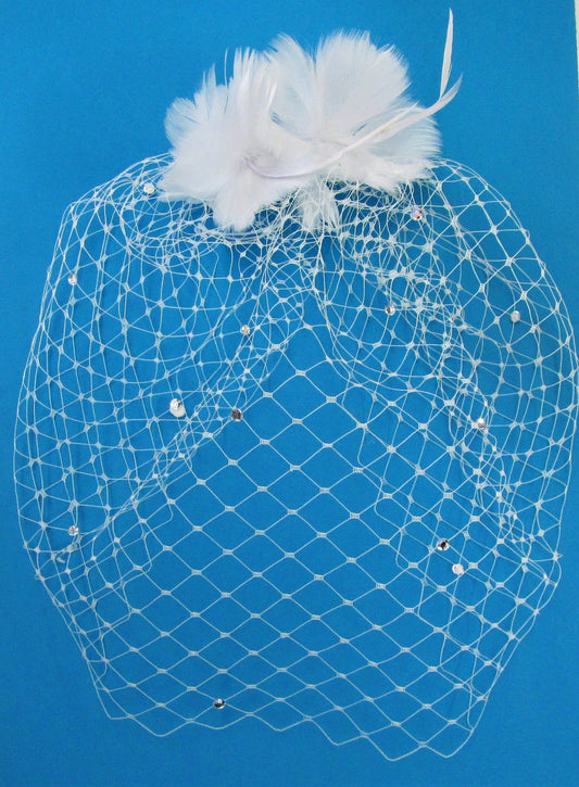 Handcrafted white bridal hair slide with diamante veiling and feathers and diamante crystals