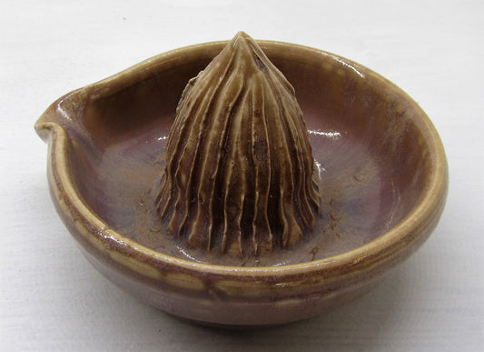 Handcrafted beautiful clay lemon squeezer