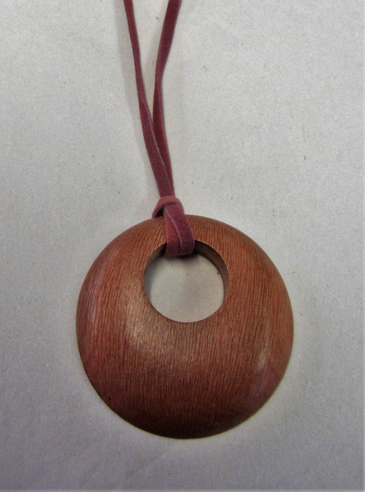 Handcrafted wooden pendent on pink suede necklace