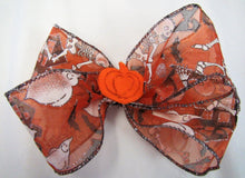 Load image into Gallery viewer, Handcrafted Halloween Bow - Orange Skeletons