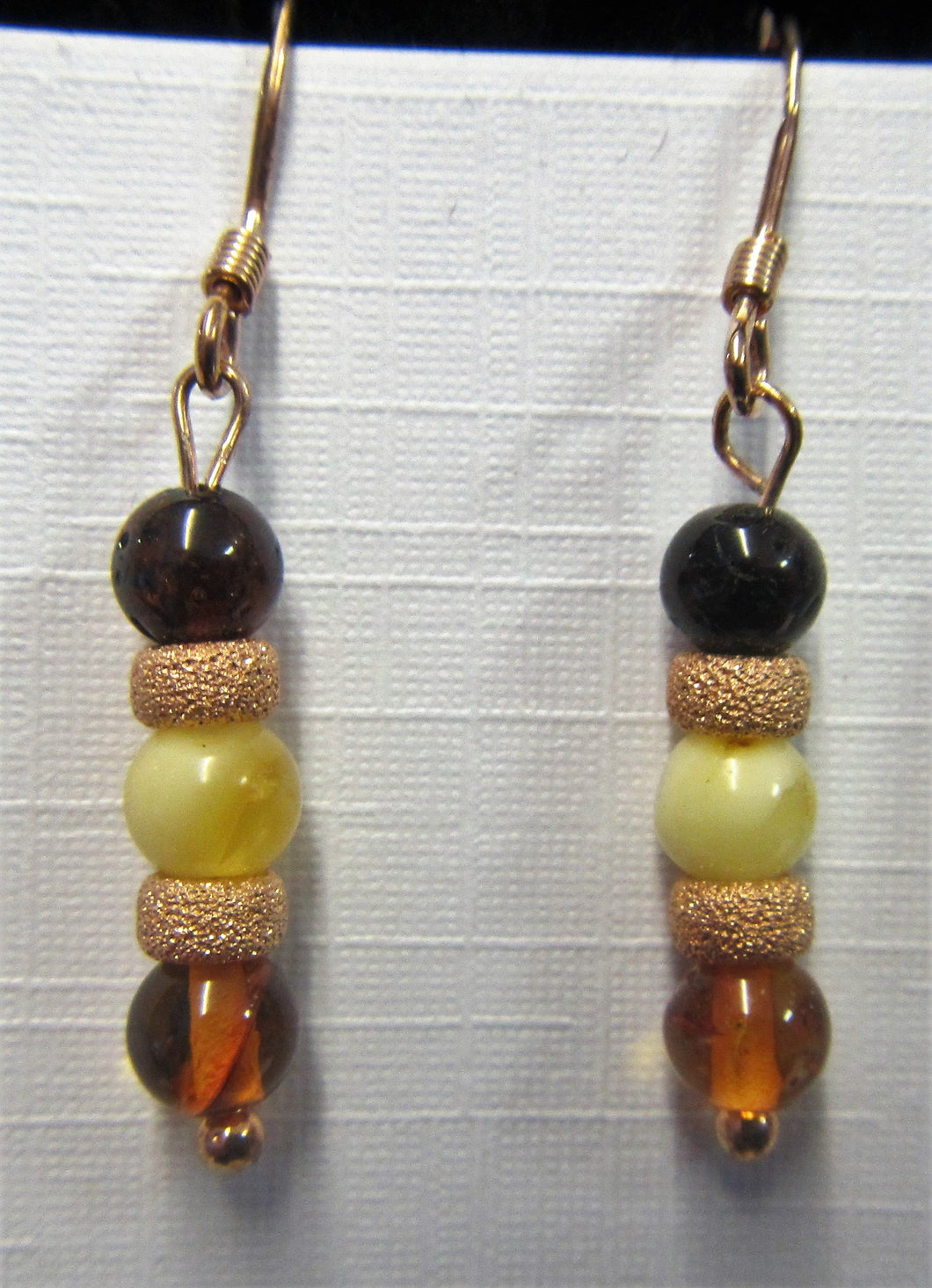 Handcrafted rose gold and amber earrings on rose hooks