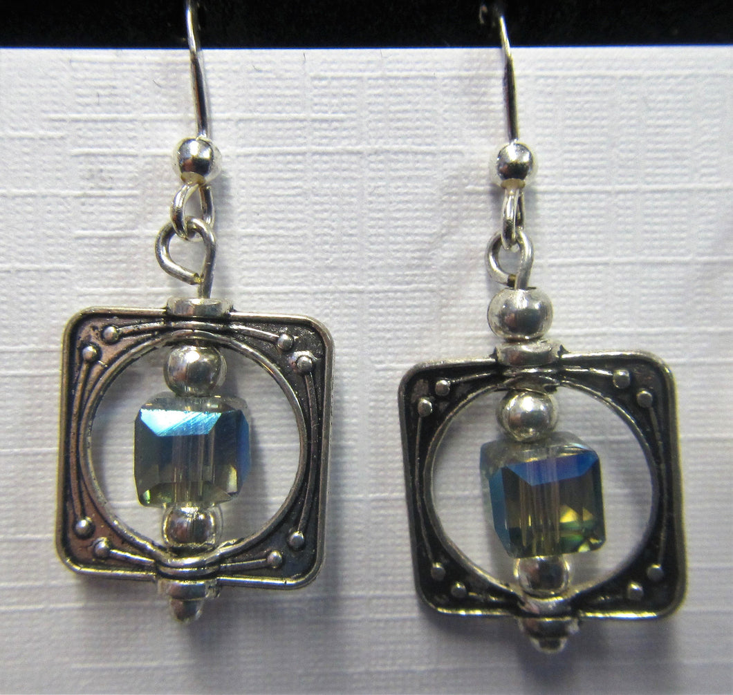 Handcrafted sterling silver blue stone caged earrings on Sterling silver hooks