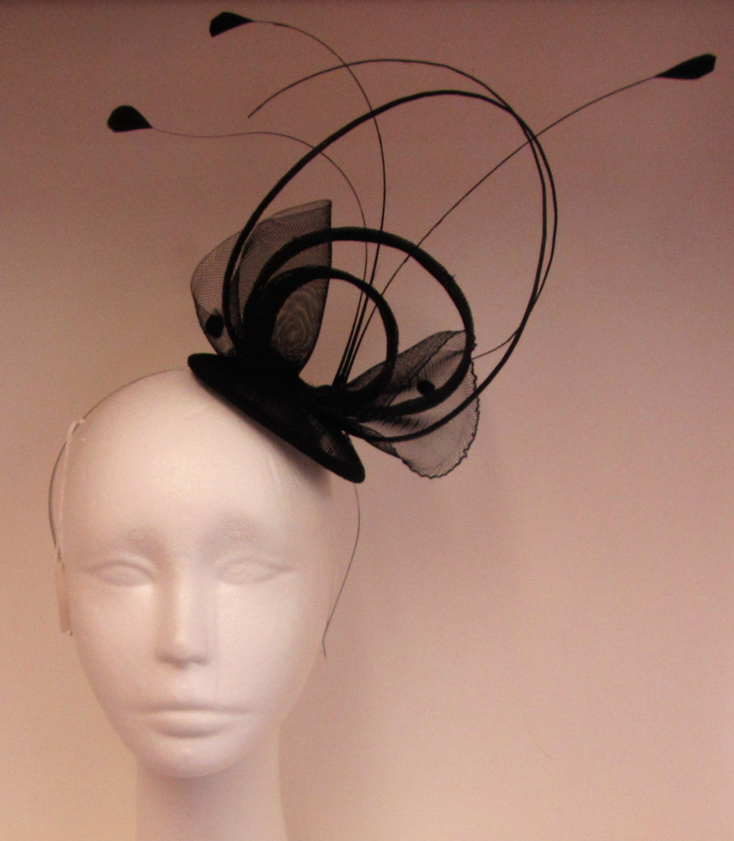 Handcrafted Black fascinator on a hair band