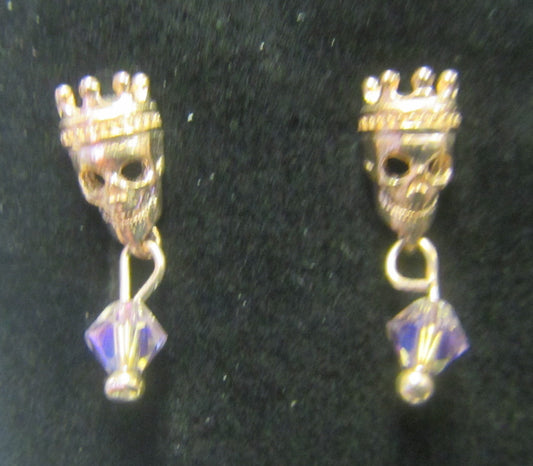 Handcrafted rose gold skull earrings on rose gold posts and butterfly backs