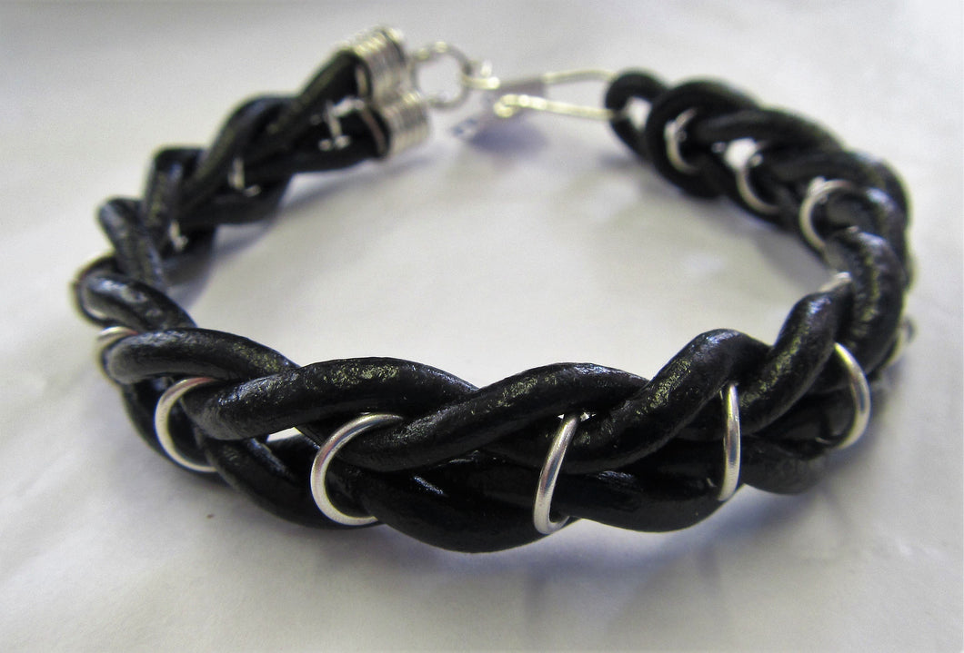 Handcrafted sterling silver and leather bound bracelet