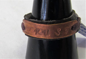 Handcrafted leather and copper rings with wording