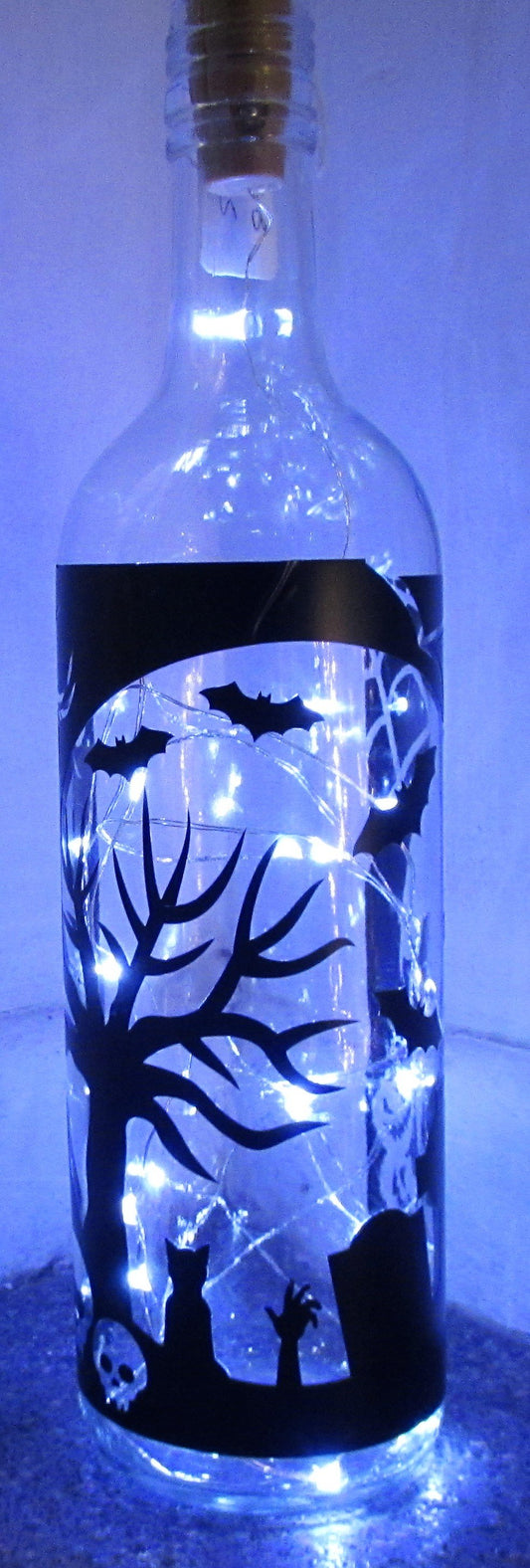 Unique handcrafted Halloween light up bottle with grave yard scene