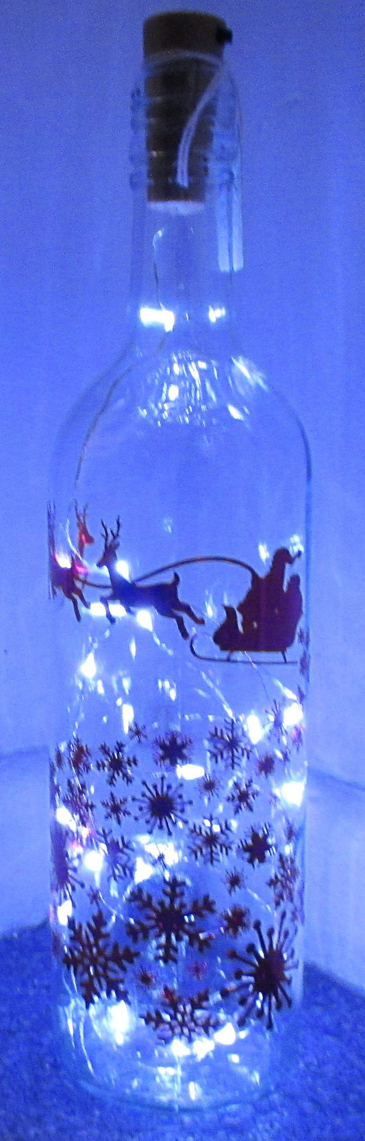 Unique handcrafted Santa's sleigh with snow flakes light up bottle