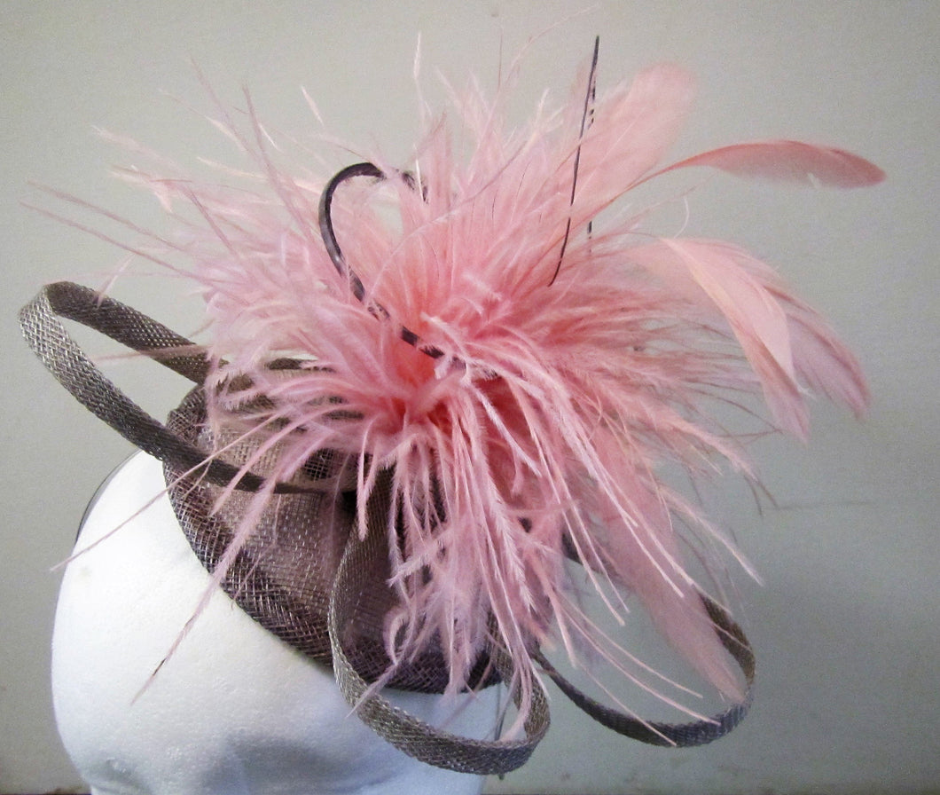 Handcrafted pewter and pink fascinator on a hair band