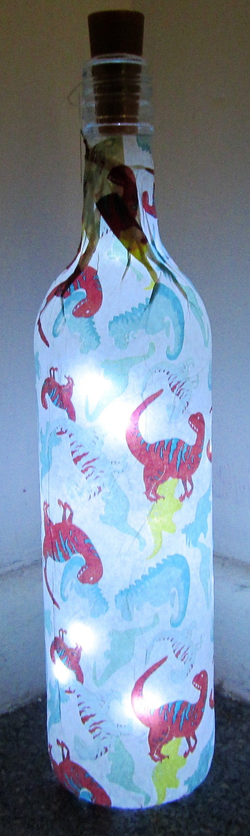 Unique handcrafted decoupage Dinosaurs print up bottle