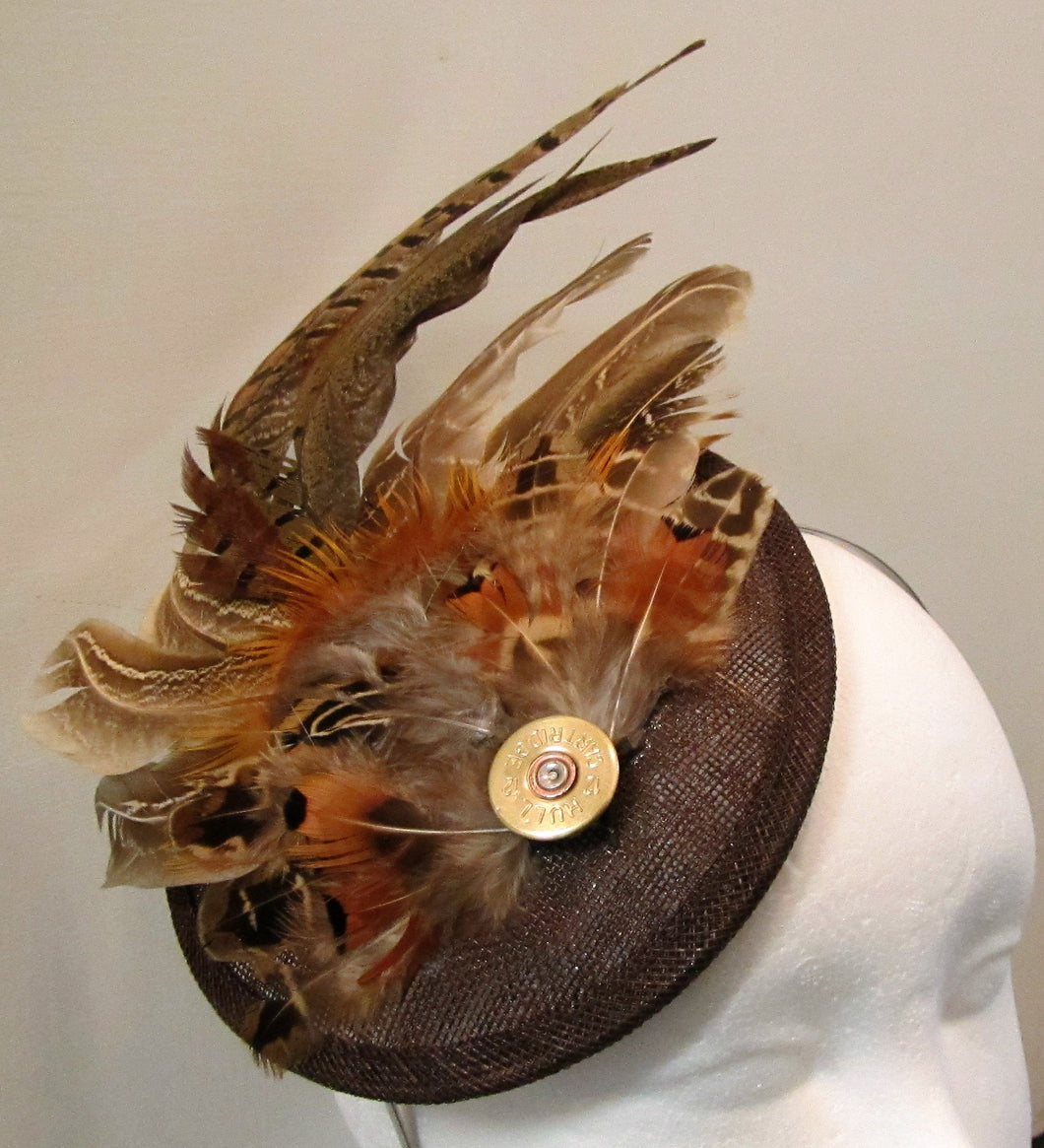 Handcrafted medium pheasant feather with cartridge fascinator on a hairband
