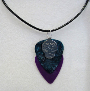 Handcrafted skull plectrum pendant on leather necklace