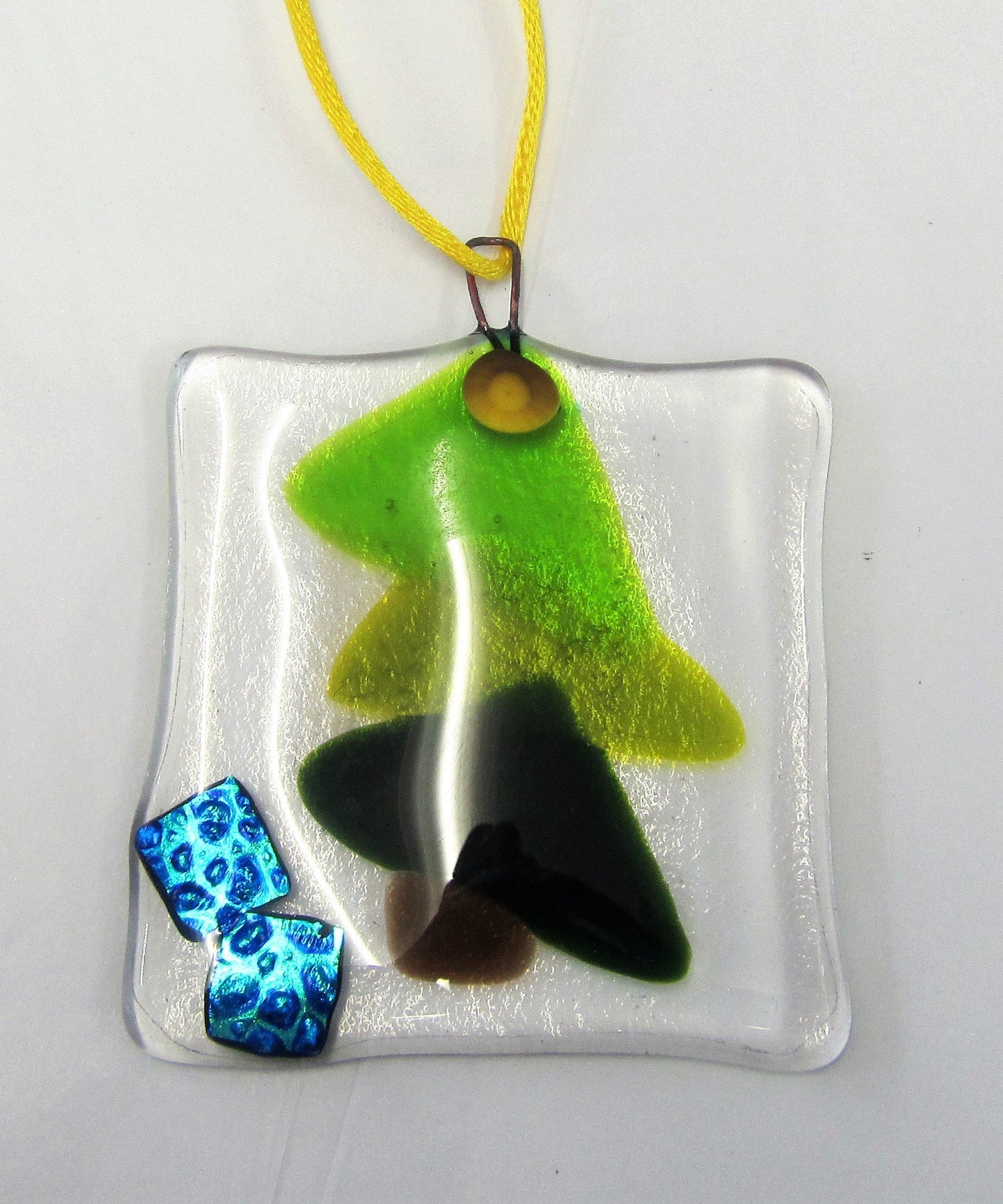 Various beautiful handcrafted fused glass tree decorations