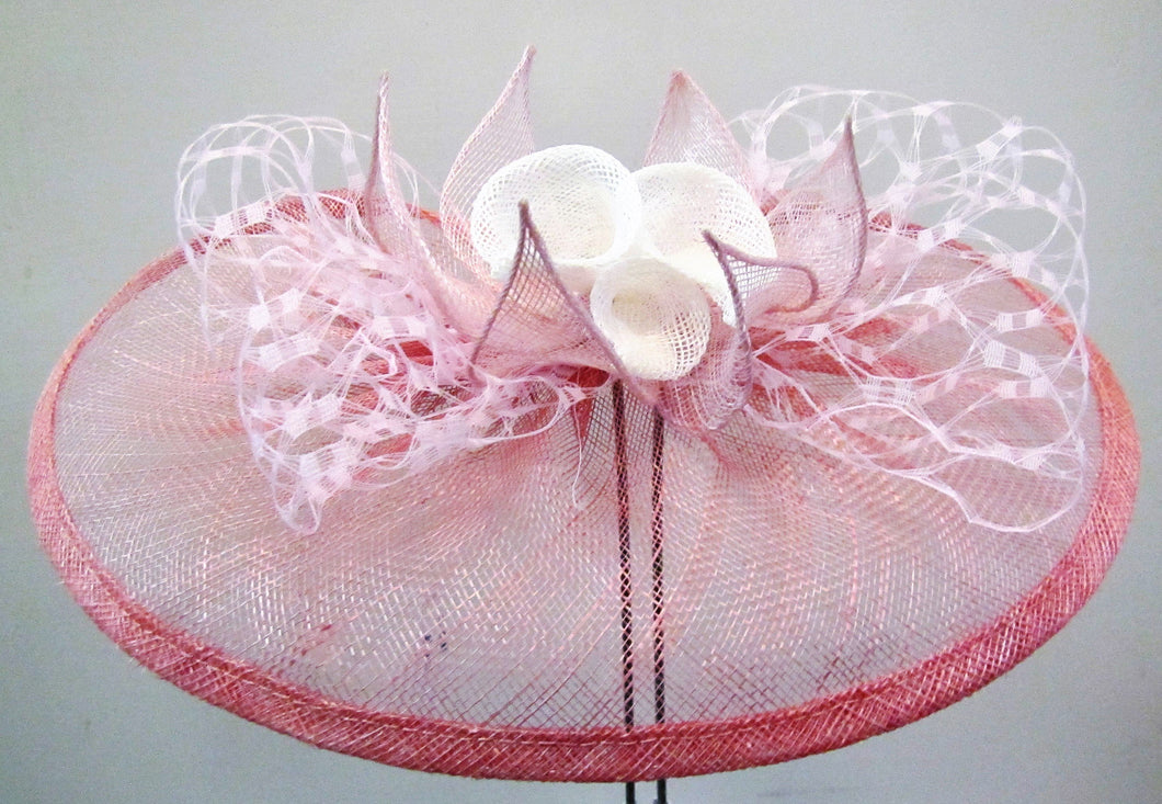 Handcrafted fascinator with white lilies and leaves on a clip or headband various colours