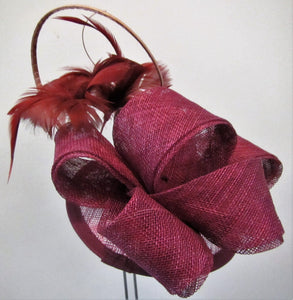 Handcrafted wine coloured bow fascinator with flowers on a hair band or clip