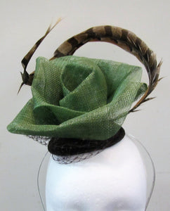 Handcrafted green flower with pheasant feather fascinator on a hair band