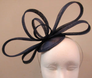 Handcrafted blue bow fascinator on a hair band