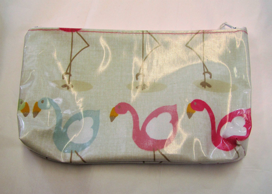 Handcrafted waxed flamingo makeup bag with zipped top.