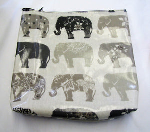 Handcrafted waxed elephant makeup bag with zipped top.