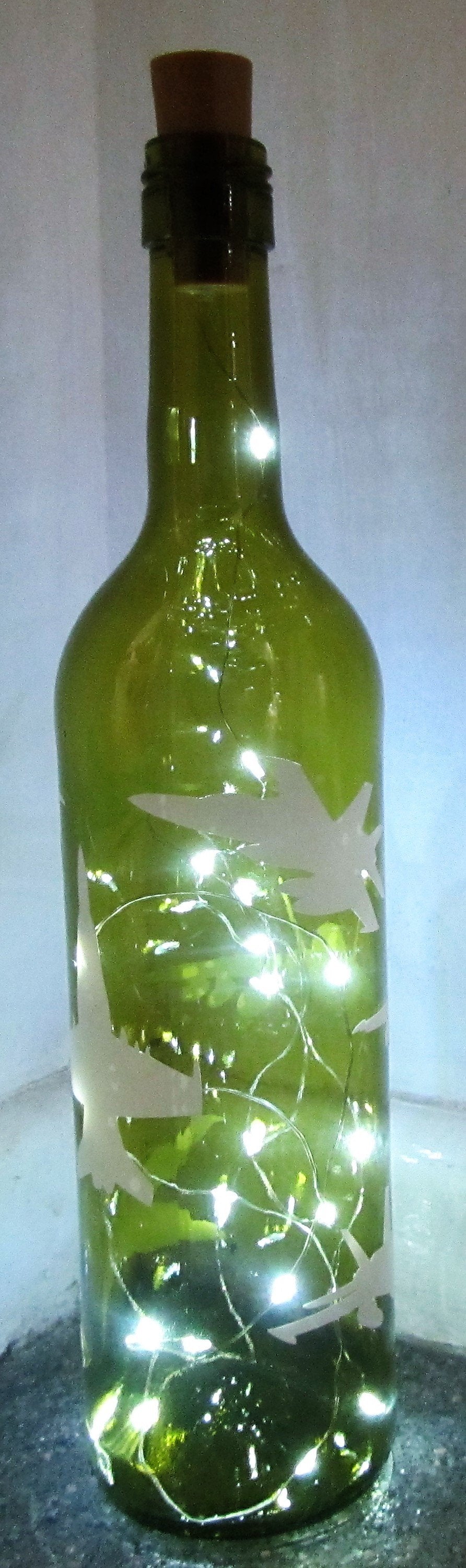 Unique handcrafted aeroplane light up green bottle