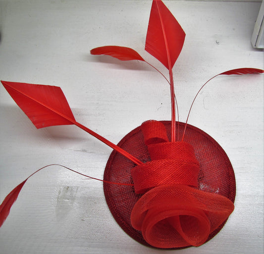 Handcrafted red flower fascinator with feathers on a hair band or clip