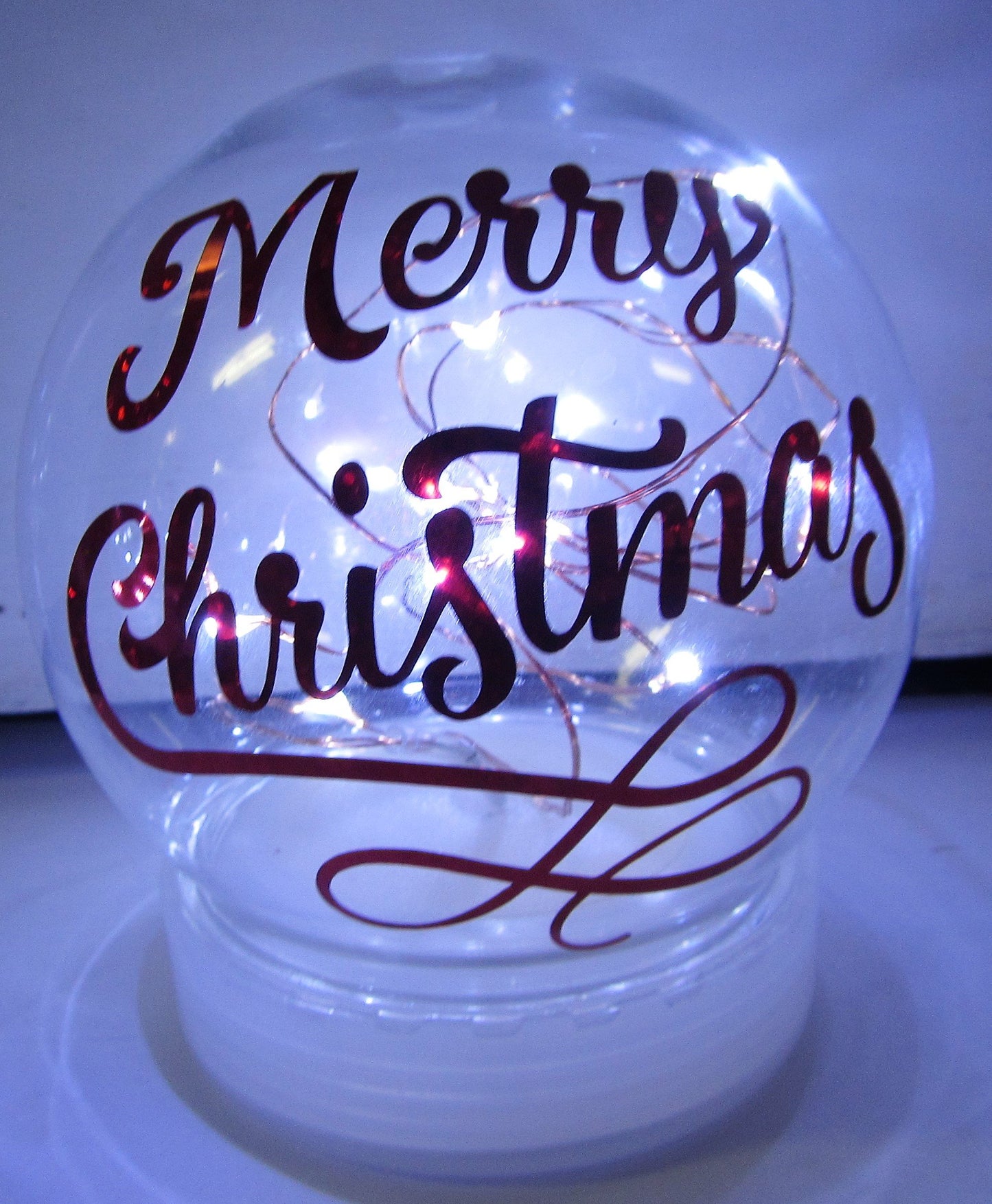 Various beautiful handcrafted light up snow globes