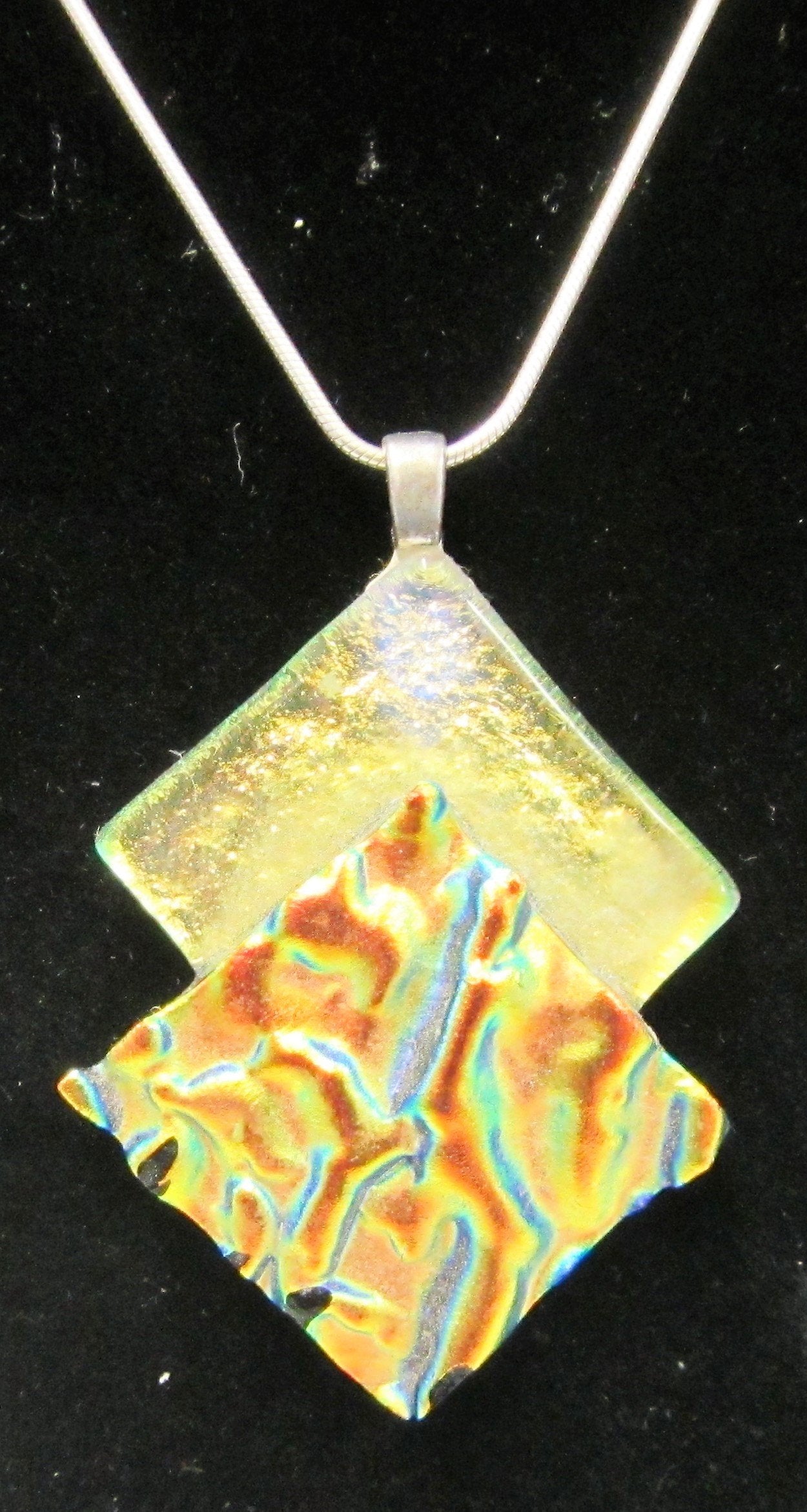 Handcrafted dichroic glass diamonds on a sterling silver necklace