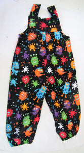 Handcrafted Black and various coloured monsters romper  12-18 months