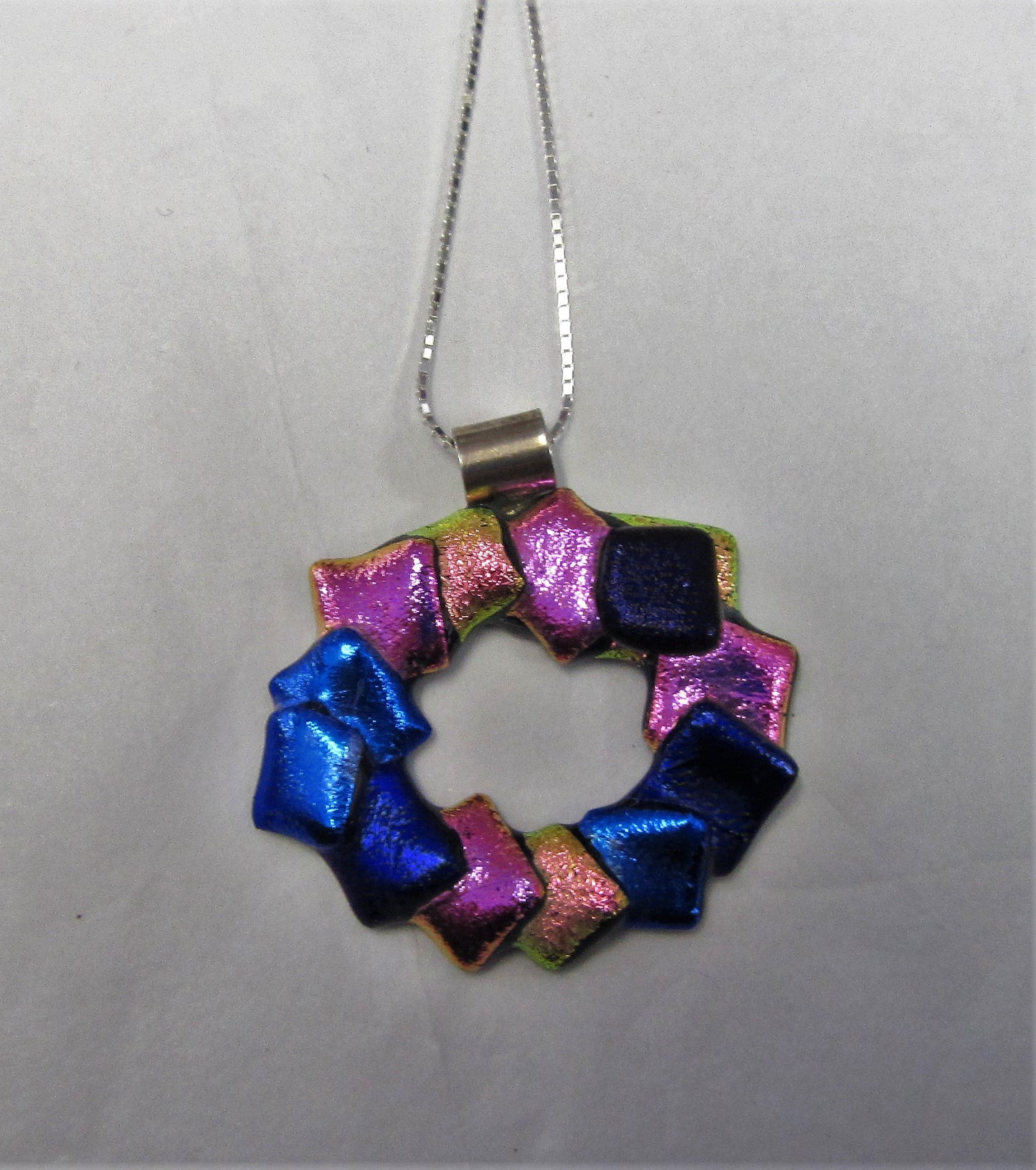 Handcrafted dichroic glass Christmas wreath pendant on a sterling silver necklace