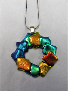 Handcrafted dichroic glass Christmas wreath pendant on a sterling silver necklace