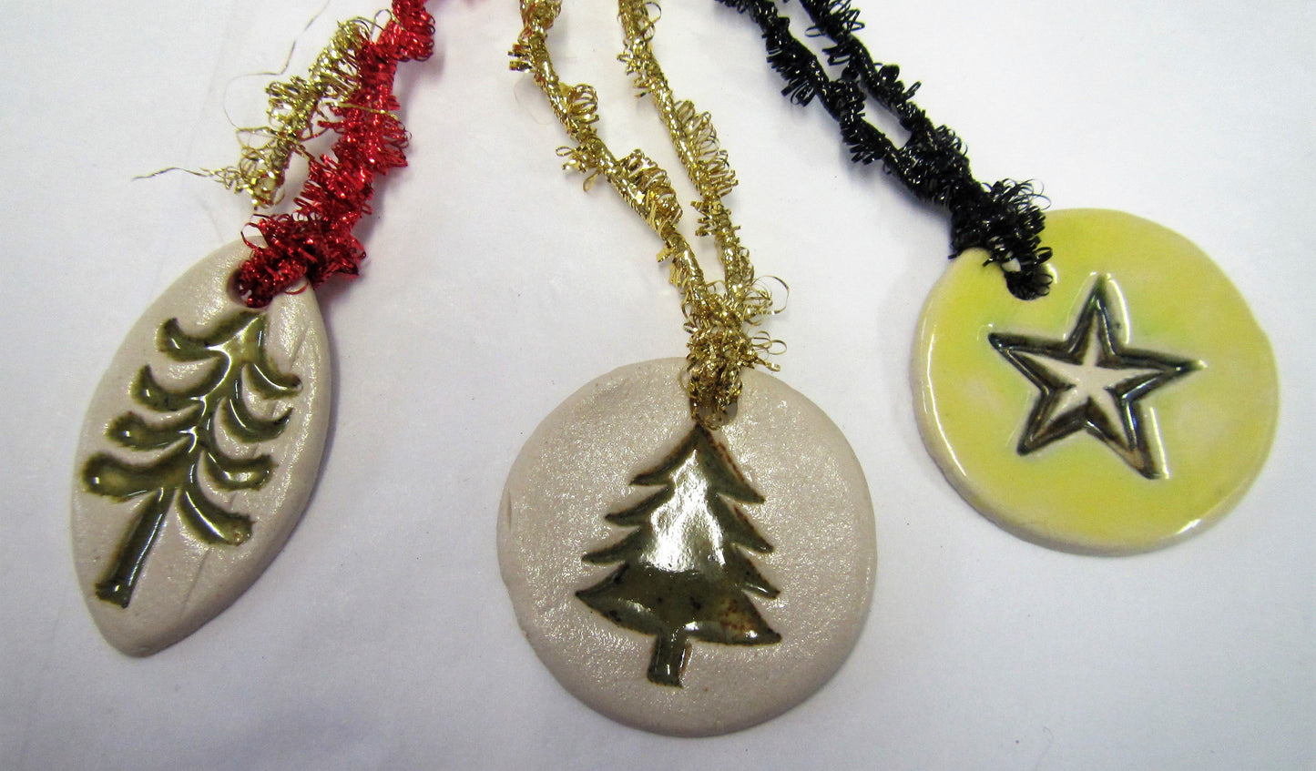 Various beautiful handcrafted ceramic set of 3 tree decorations