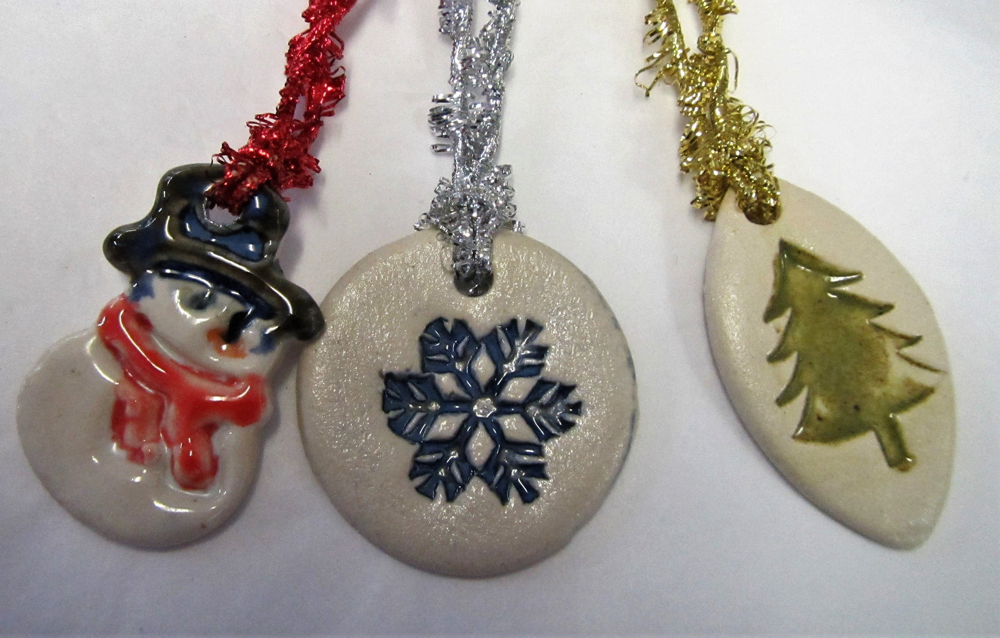 Various beautiful handcrafted ceramic set of 3 tree decorations