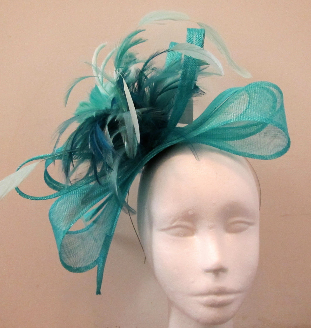 Handcrafted blue bow fascinator with feathers on a hair band various colours