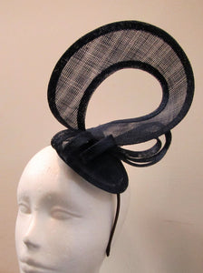 Handcrafted navy blue twist fascinator with bow on a headband