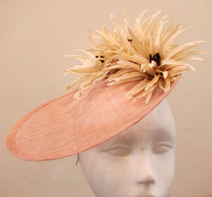 Handcrafted beige turned up disk with cream flowers fascinator on a headband