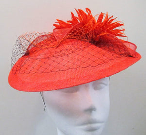 Handcrafted burnt orange  disk with cream flowers and netting fascinator on a headband