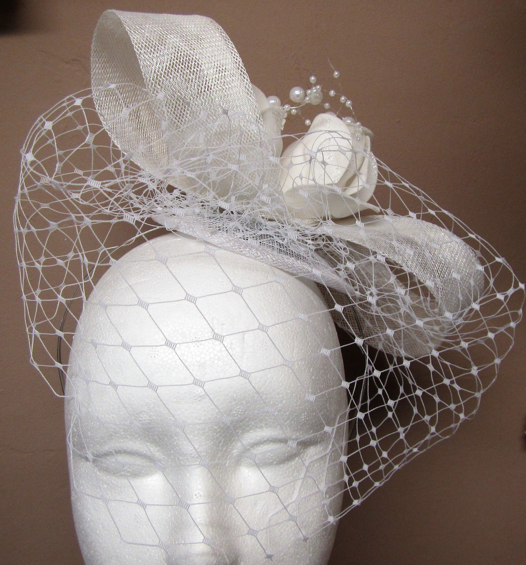Handcrafted Bridal hair piece bow with roses and pearls with netting on a hair band
