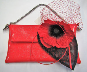 Handcrafted red and black poppy fascinator on a hair comb