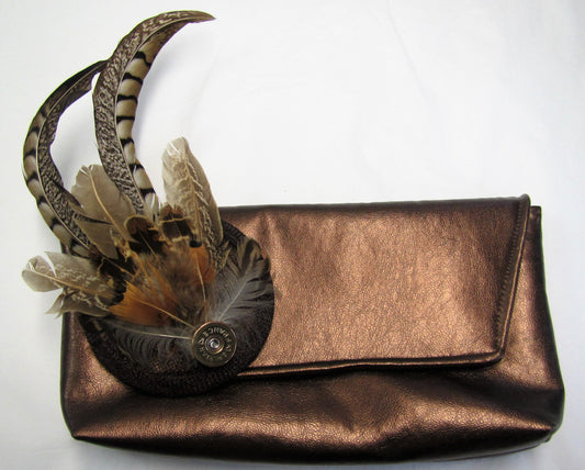 Handcrafted small pheasant feather with cartridge fascinator on a comb slide