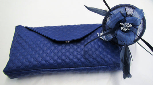 Handcrafted small blue flower and feather fascinator on a headband