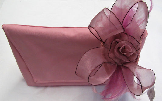 Handcrafted small pink flower and feather fascinator on a headband