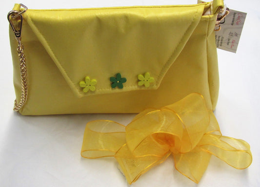 Handcrafted yellow bow fascinator on a hair band or hair clip