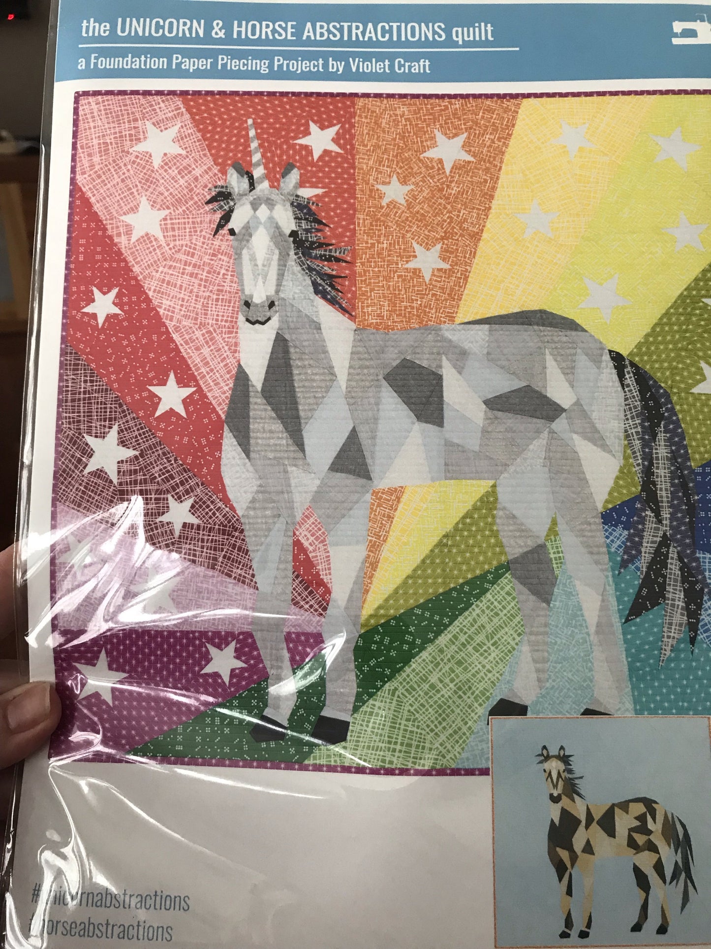 The Unicorn & Horse Abstraction quilt byViolet Craft